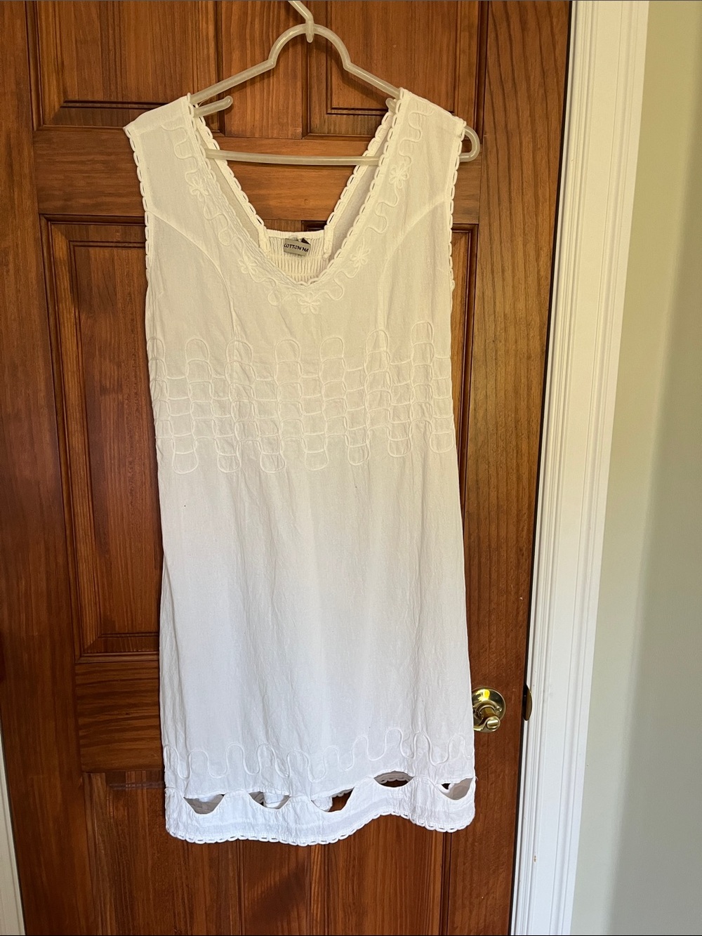 White Embroidered Sleeveless cotton dress.